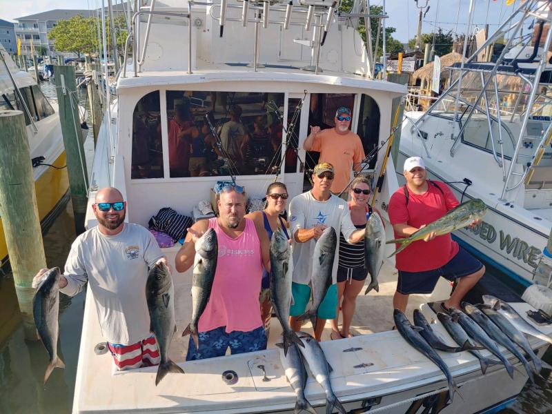 Stefan Talabisco, Adrienne Talabisco, Tug Welsh, Chris Corbit, Julie Trickey and Jamie Trickey chartered the boat All In with captain Scott Stapleford on a mission to catch tuna. The tuna bite was slow but got swarmed several times with these gator blues. They trolled Massey’s canyon; the blues hit on cedar plugs and ballyhoo. Everyone on the trip got a chance to reel a fish in and Adrienne landed the Mahi Mahi.